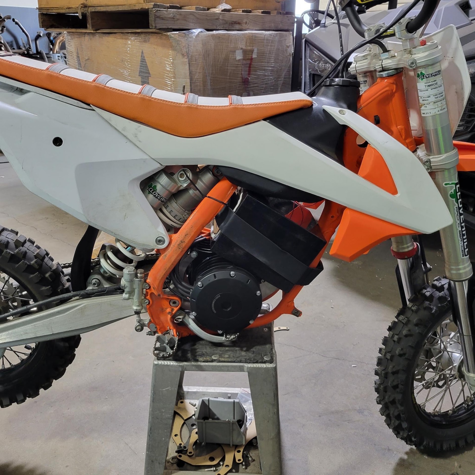 Orange and white electric dirt bike conversion detail