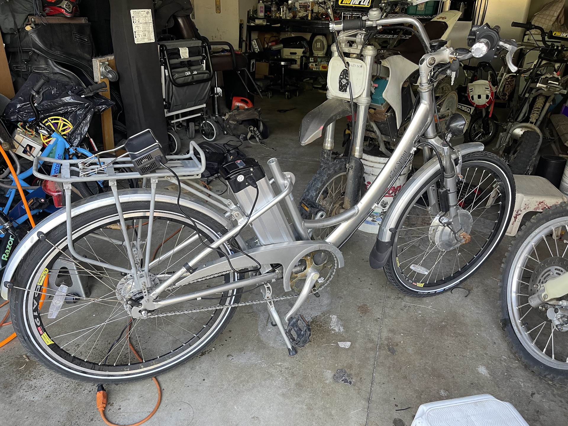 Silver step-through electric bicycle in the workshop